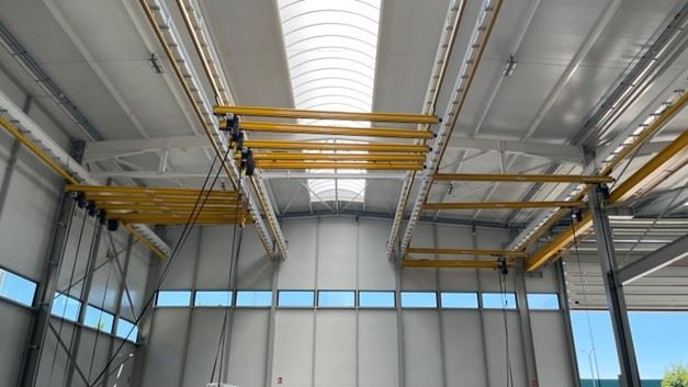 The material handling specialist delivered six console cranes and 12 KBK workstation lifting systems