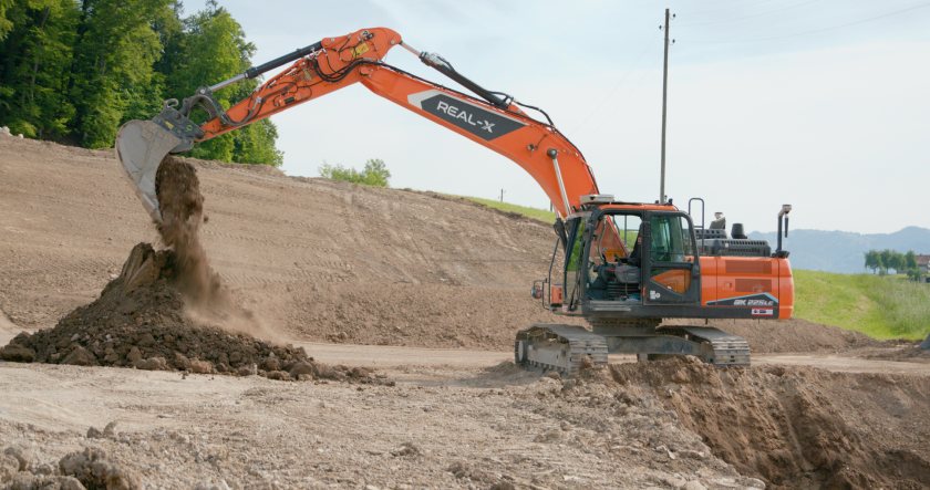The Develon DX225LC-7X is working autonomously at a former quarry site in Switzerland